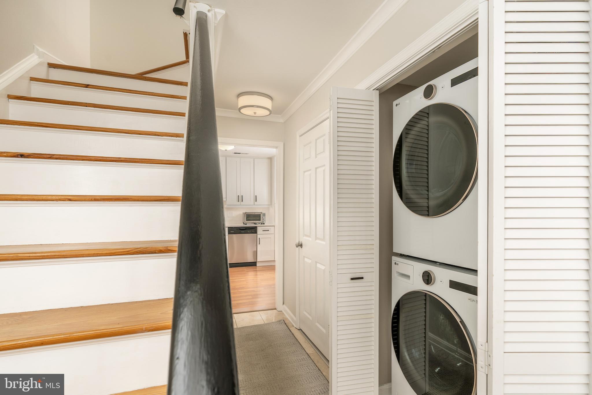 5050 Bradley Boulevard, Unit 6 Chevy Chase, MD 20815 - Photo 19 of 25 a view of a hallway with washer and dryer