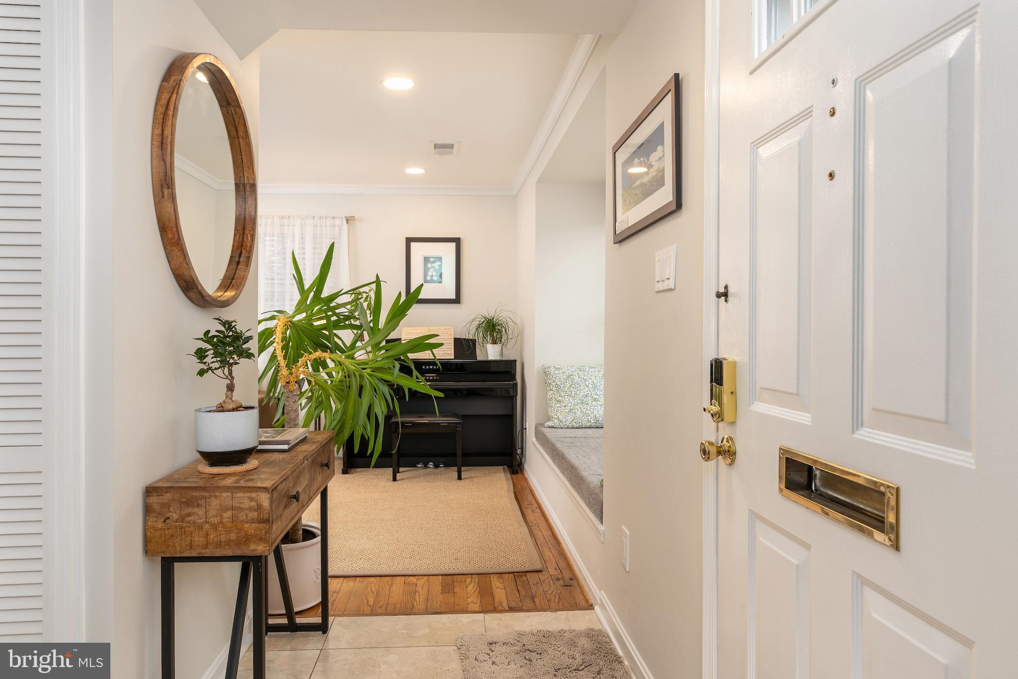 5050 Bradley Boulevard, Unit 6 Chevy Chase, MD 20815 - Photo 2 of 25 a hallway with table and sofas