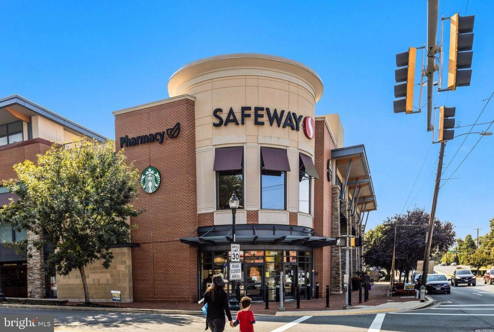 5050 Bradley Boulevard, Unit 6 Chevy Chase, MD 20815 - Photo 23 of 25 a front view of a building with street