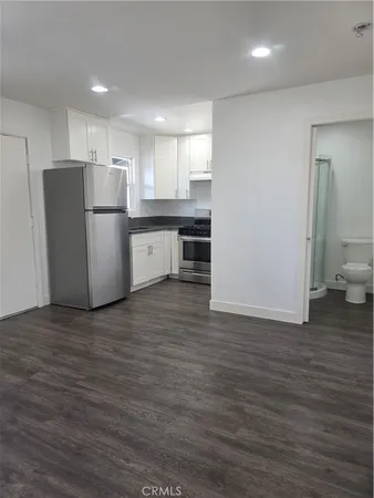 a view of kitchen with wooden floor