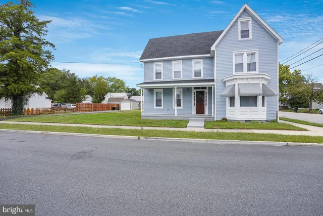a front view of a house with a swimming pool