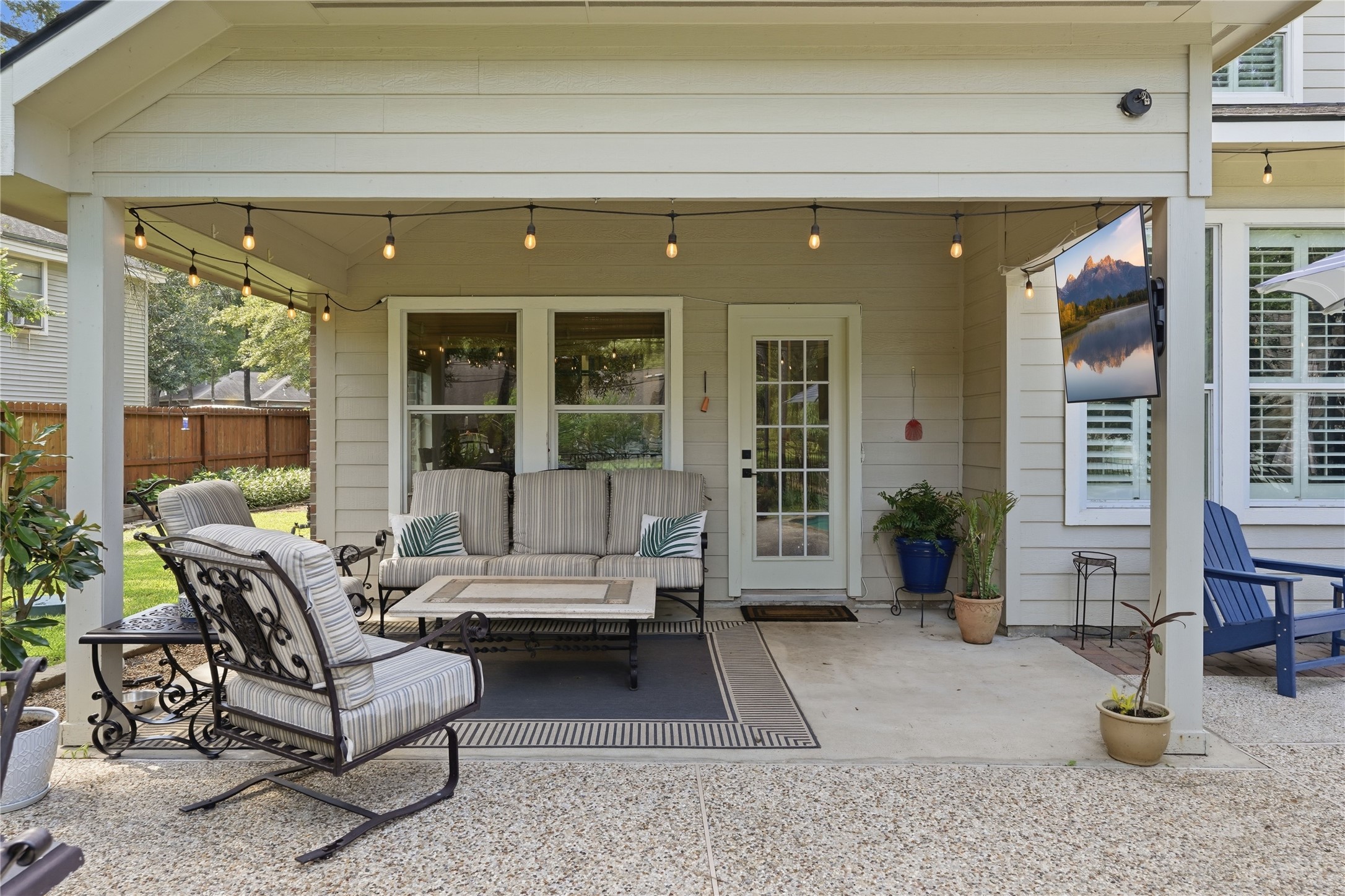 2408 Hollowbrook Lane Conroe, TX 77384 - Photo 35 of 49 Welcome to the back yard oasis! Enjoy a comfortable seat under the covered patio.