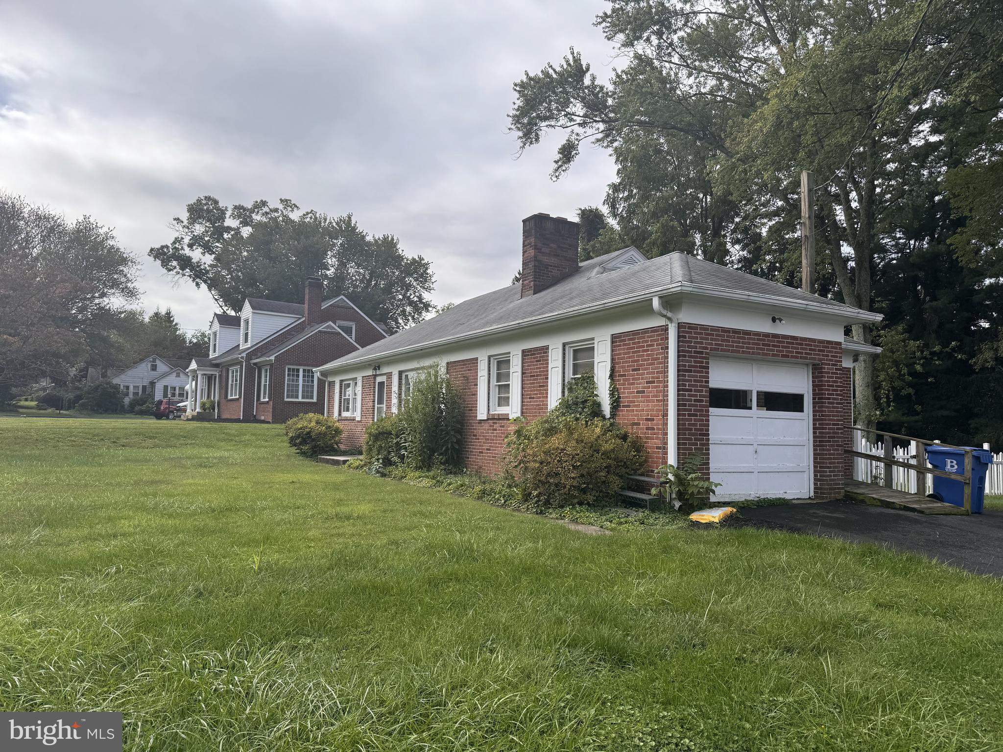 302 South Fountain Green Road Bel Air, MD 21015 - Photo 2 of 16 a front view of a house with a garden and trees