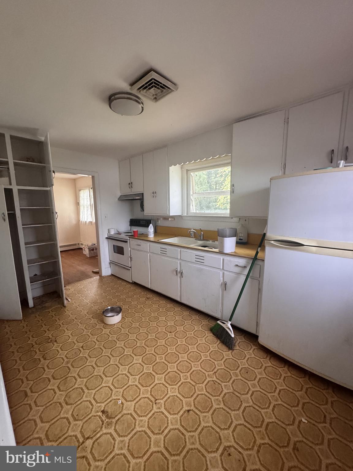 302 South Fountain Green Road Bel Air, MD 21015 - Photo 3 of 16 a kitchen with a sink and a refrigerator