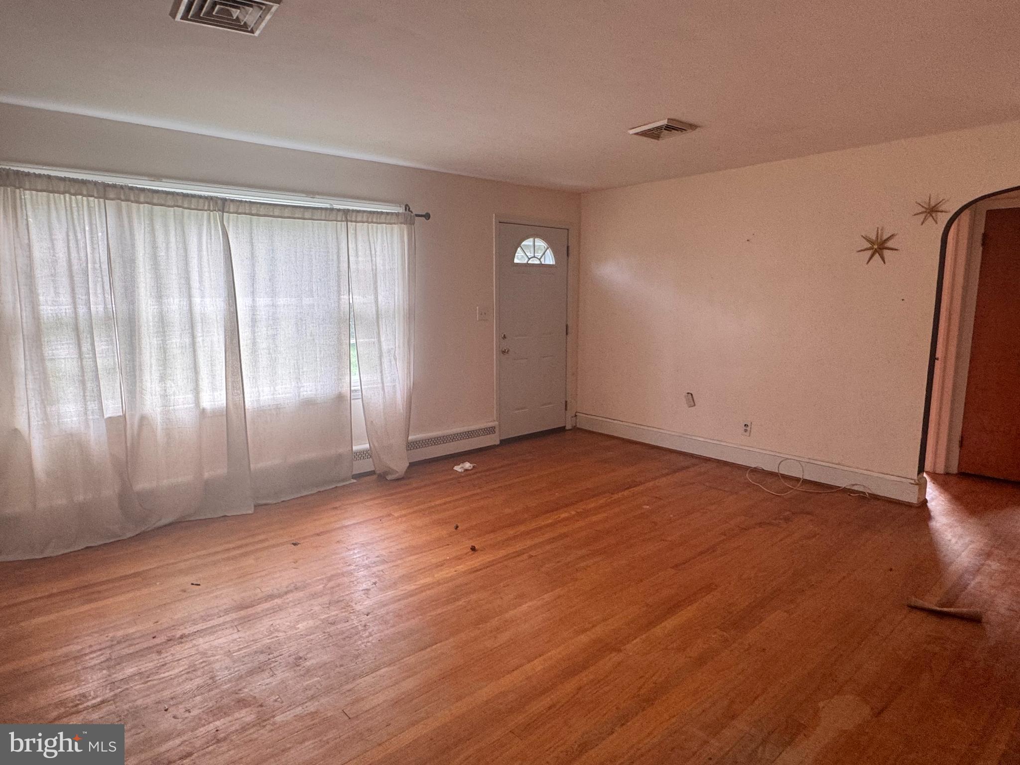 302 South Fountain Green Road Bel Air, MD 21015 - Photo 6 of 16 an empty room with wooden floor and windows