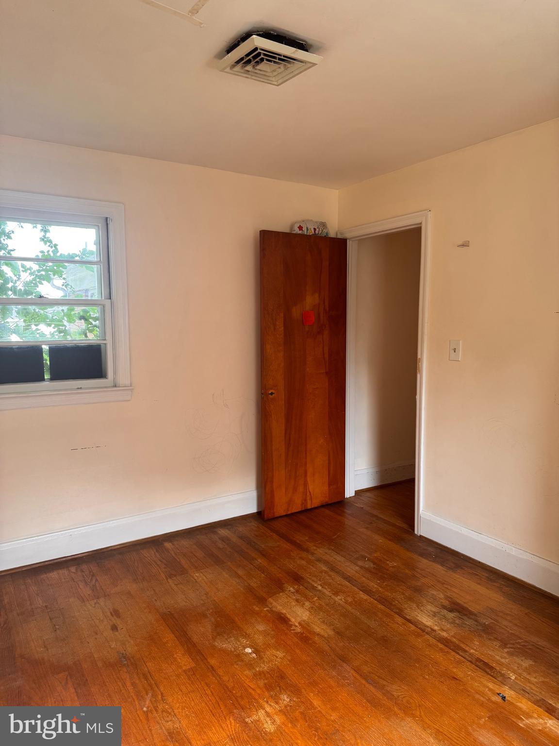 302 South Fountain Green Road Bel Air, MD 21015 - Photo 8 of 16 an empty room with wooden floor and windows