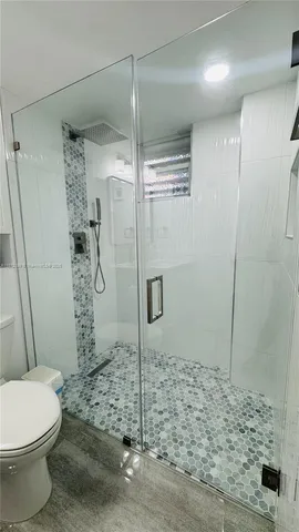 a bedroom with furniture and a baby crib