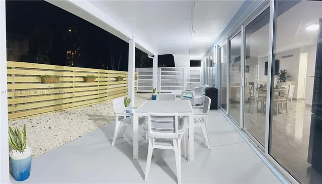 a living room with furniture and flat screen tv