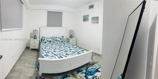 a bed room with a bed and couch