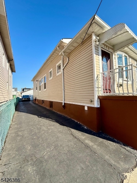 195 Maple Street Kearny, NJ 07032 - Photo 2 of 24 a view of a house with a roof deck