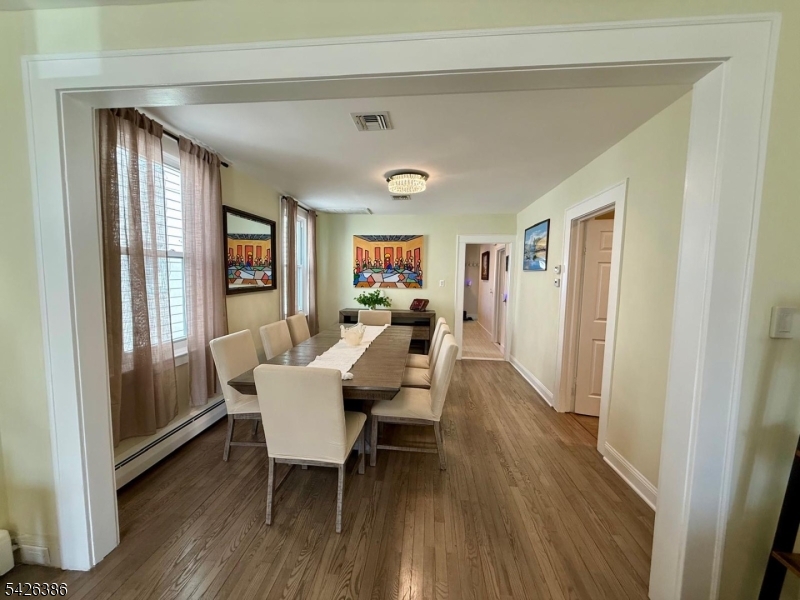 195 Maple Street Kearny, NJ 07032 - Photo 7 of 24 a dining room with furniture and wooden floor