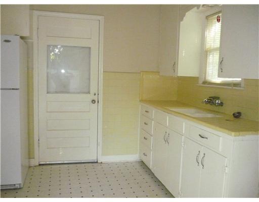 338 Rossiter Street Corpus Christi, TX 78411 - Photo 3 of 4 a bathroom with a sink and a mirror