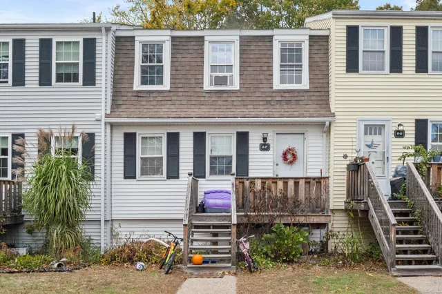 a view of a house with more windows and plants