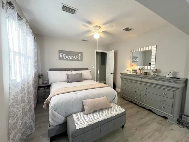 a bedroom with a bed and window