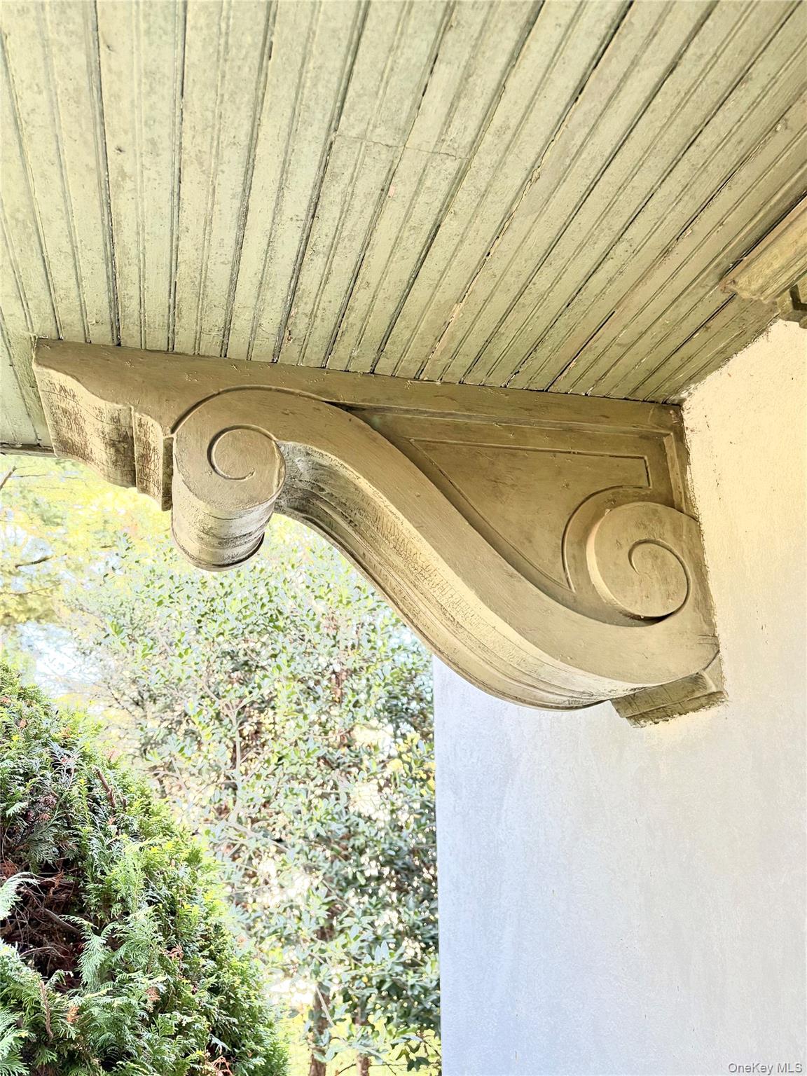 236 Arleigh Road Queens, NY 11363 - Photo 16 of 25 Front Entrance. substantial wood brackets and deep projecting hood fit nicely with Arts & Crafts/Craftsman detailing.