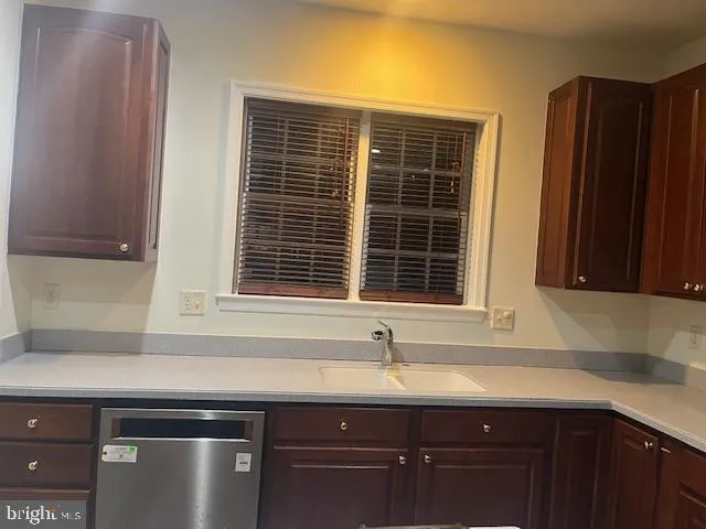 a kitchen with a sink and a window