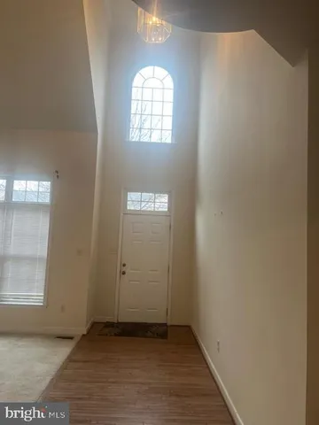 an empty room that has a window in it