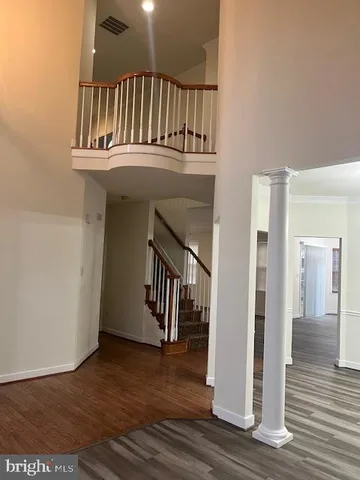 a view of entryway with wooden floor