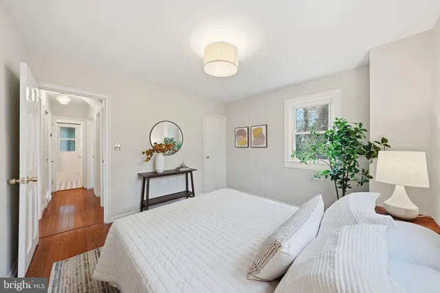 a bedroom with a bed and window