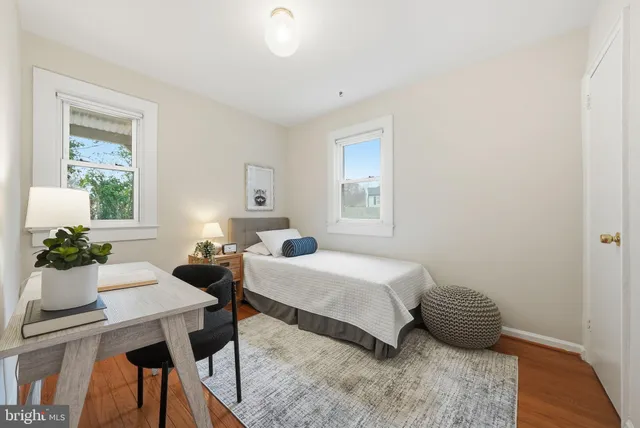 a bedroom with a bed and a table