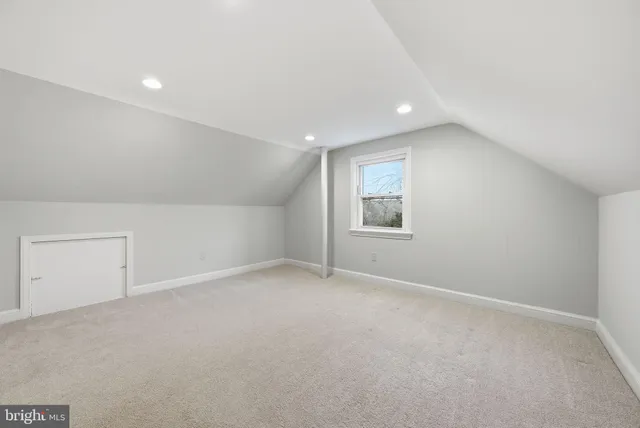 an empty room with a empty space and windows