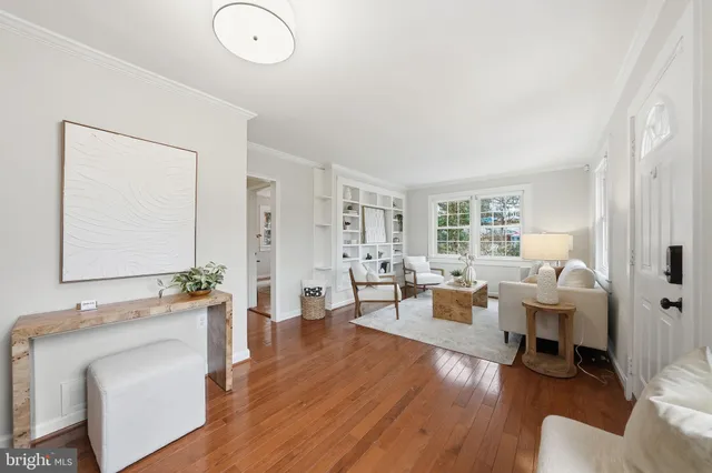 a living room with furniture or couch and a wooden floor