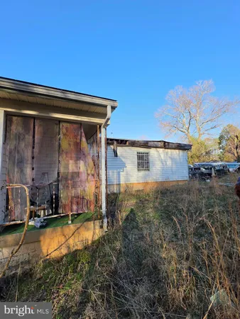 a view of a small pool in the backyard