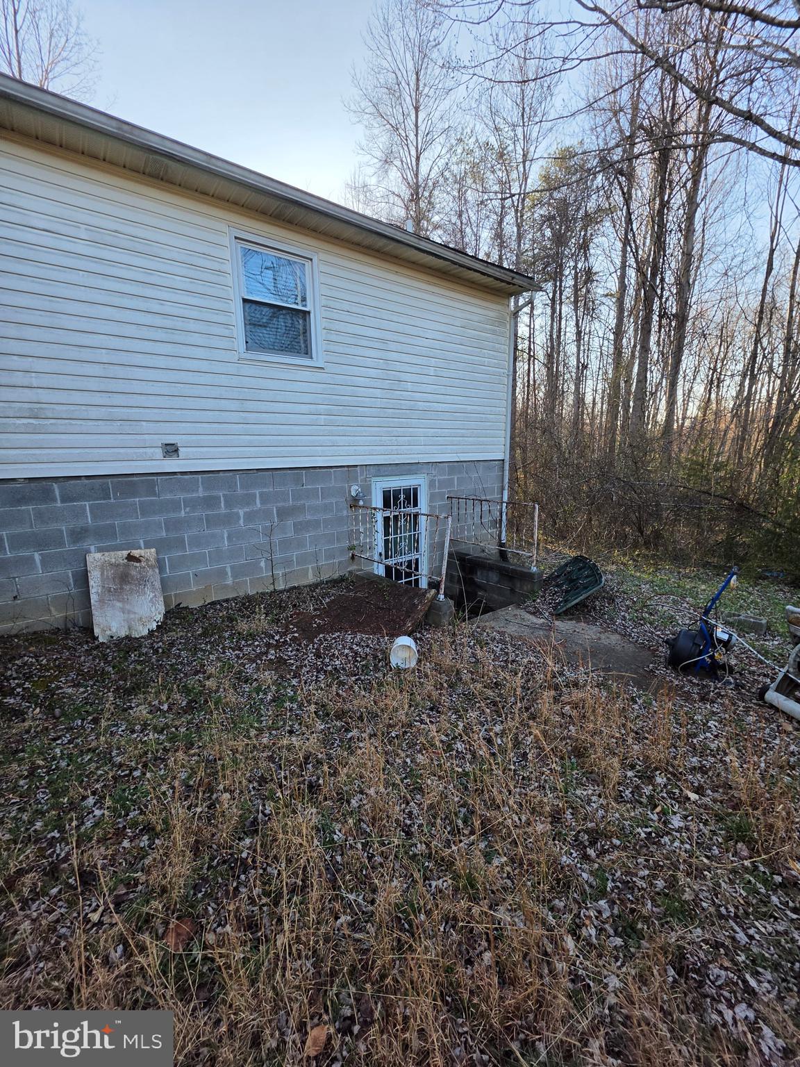 2263 Buckner Road Bumpass, VA 23024 - Photo 4 of 6 a backyard of a house with lots of green space