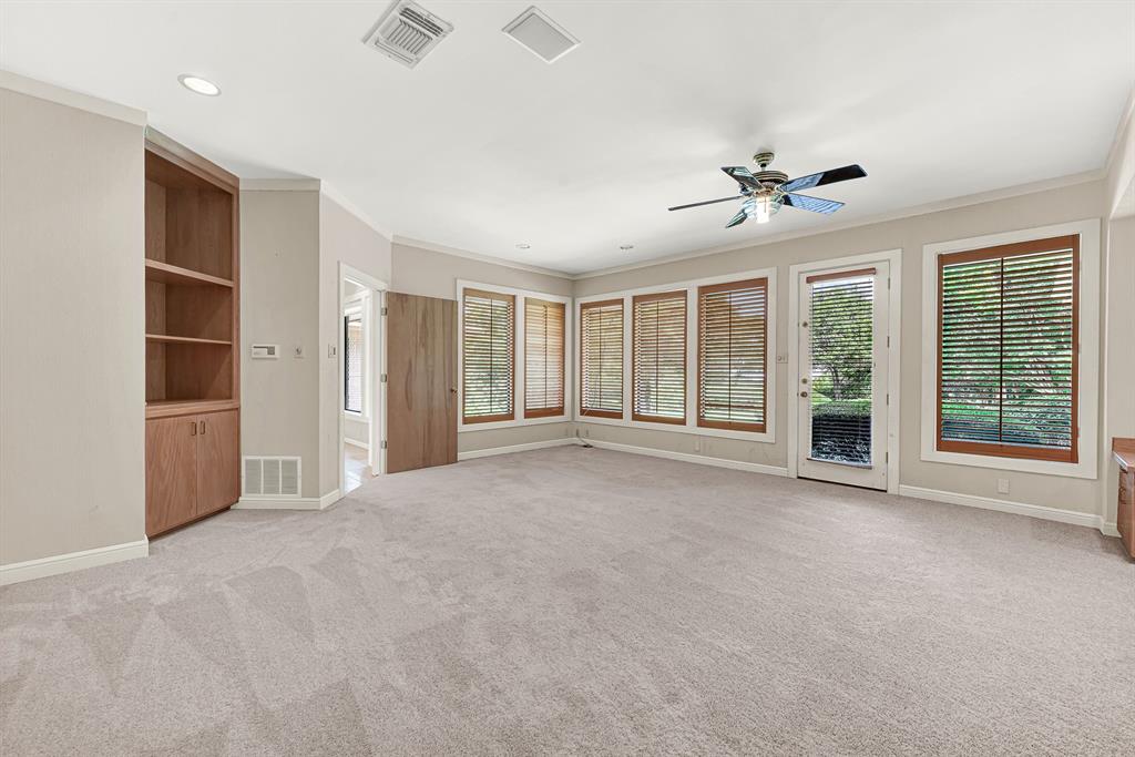 933 Mobley Road Cedar Hill, TX 75104 - Photo 16 of 40 Built in media cabinetry, views of backyard, private deck entrance.