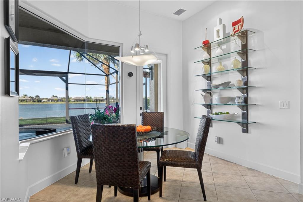 12095 Wicklow Lane Naples, FL 34120 - Photo 13 of 50 a view of a dining room with furniture window and outside view