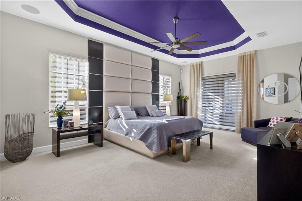 12095 Wicklow Lane Naples, FL 34120 - Photo 14 of 50 a spacious bedroom with a bed and a window