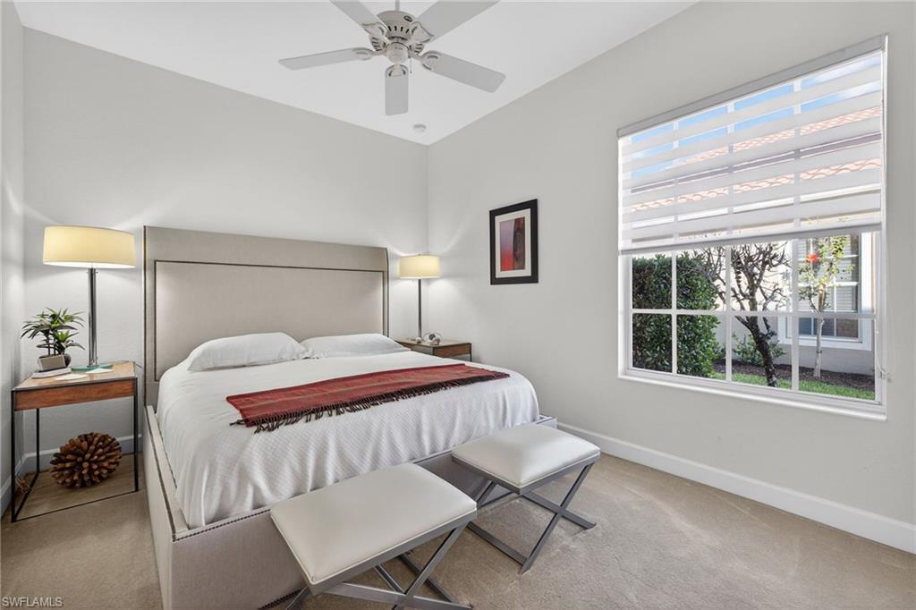 12095 Wicklow Lane Naples, FL 34120 - Photo 20 of 50 a bedroom with a bed and a window