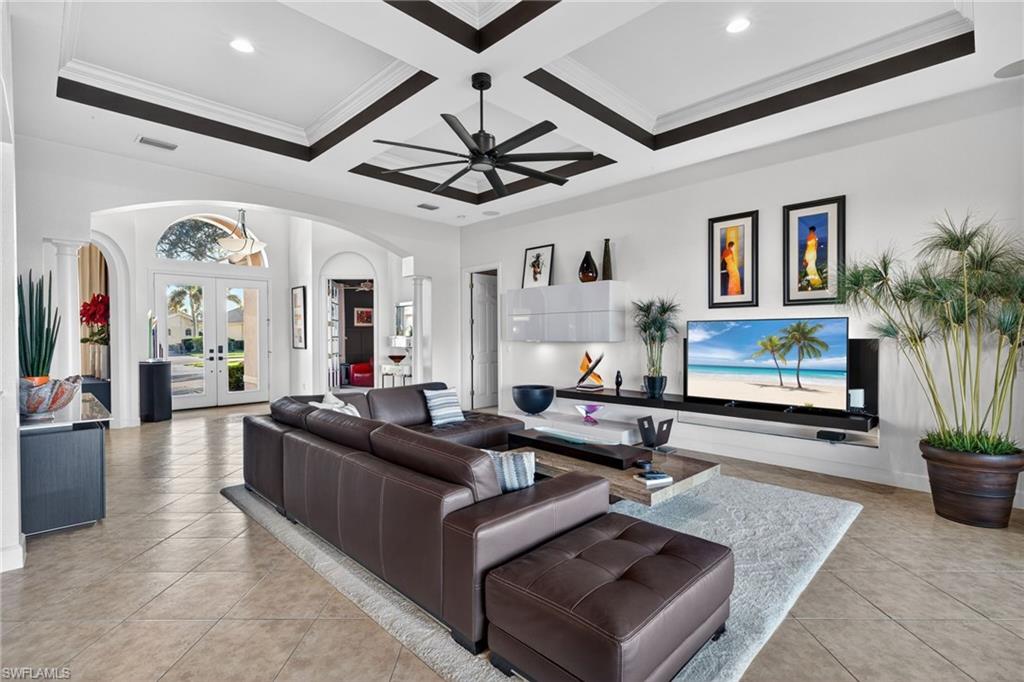 12095 Wicklow Lane Naples, FL 34120 - Photo 3 of 50 a living room with furniture potted plant and a ceiling fan