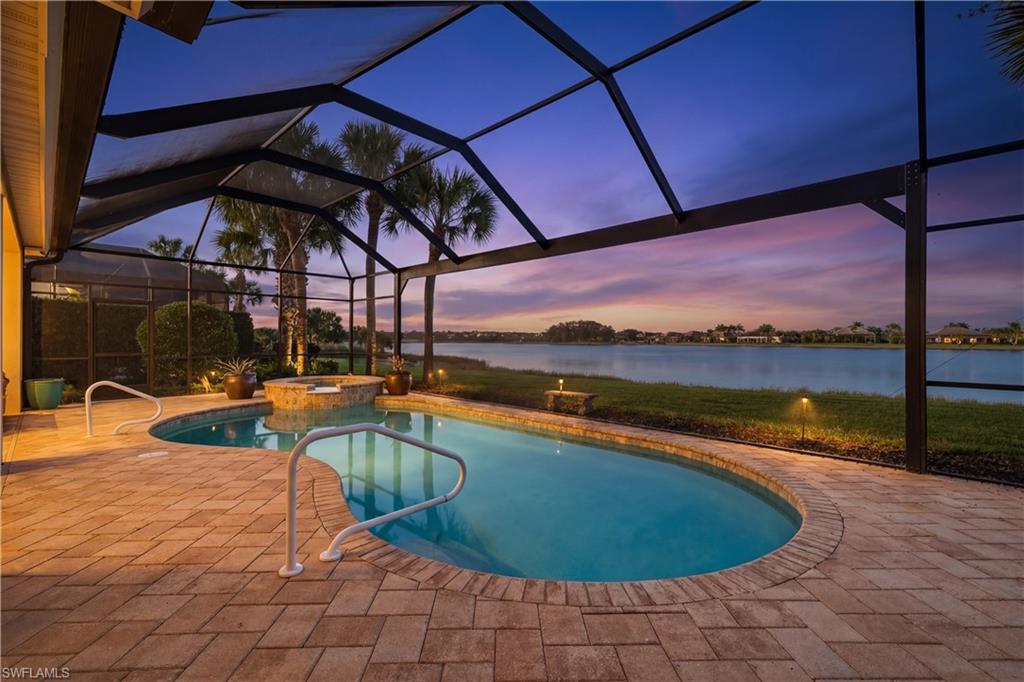 12095 Wicklow Lane Naples, FL 34120 - Photo 31 of 50 a view of a swimming pool with a patio