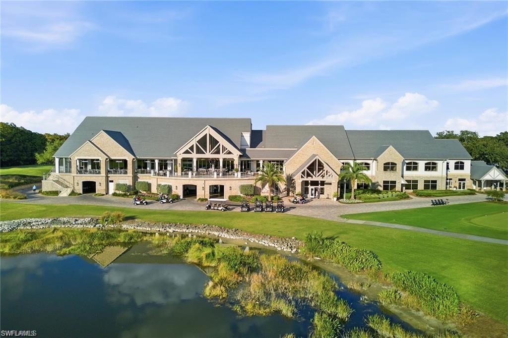 12095 Wicklow Lane Naples, FL 34120 - Photo 34 of 50 a view of a house with a big yard and large trees
