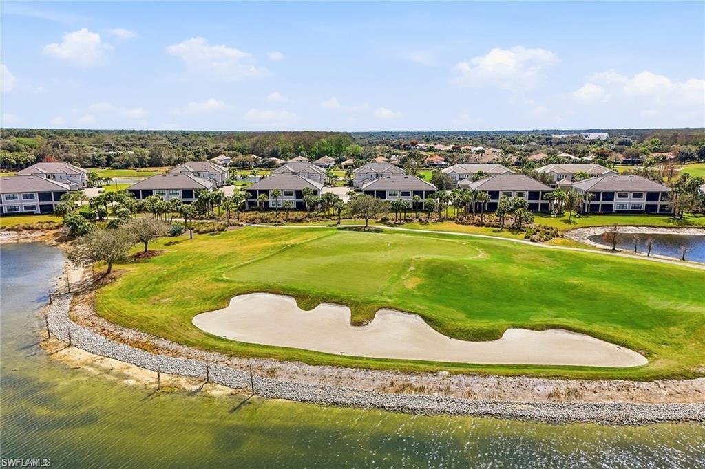 12095 Wicklow Lane Naples, FL 34120 - Photo 40 of 50 a view of a swimming pool with a yard