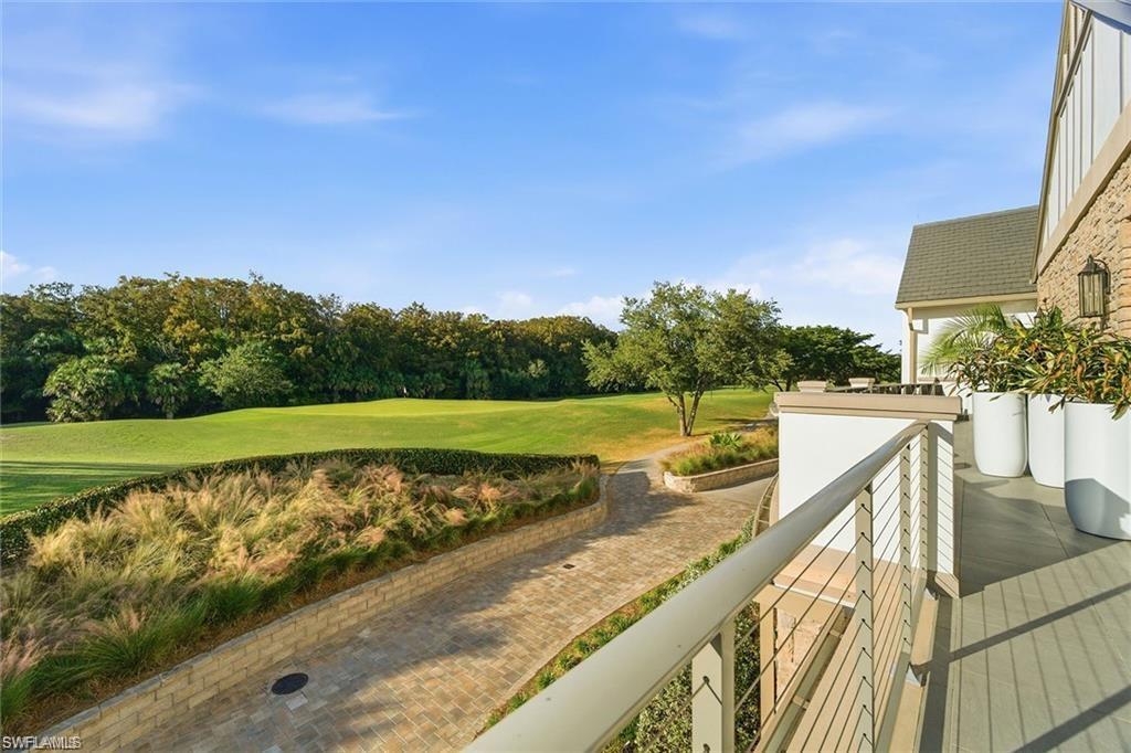 12095 Wicklow Lane Naples, FL 34120 - Photo 47 of 50 a view of a swimming pool with a patio
