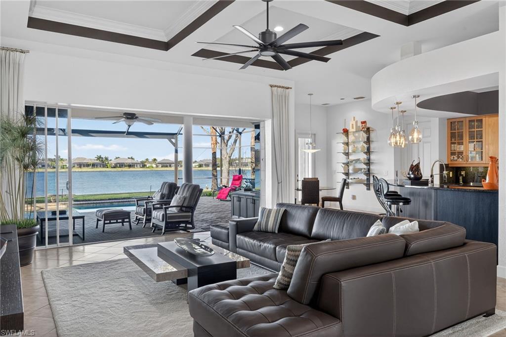12095 Wicklow Lane Naples, FL 34120 - Photo 5 of 50 a living room with furniture and a large window