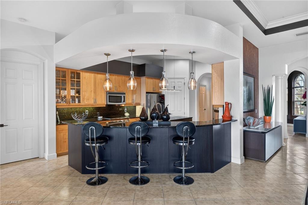 12095 Wicklow Lane Naples, FL 34120 - Photo 8 of 50 a view of a room with gym equipment