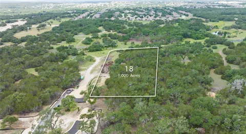 an aerial view of houses with yard