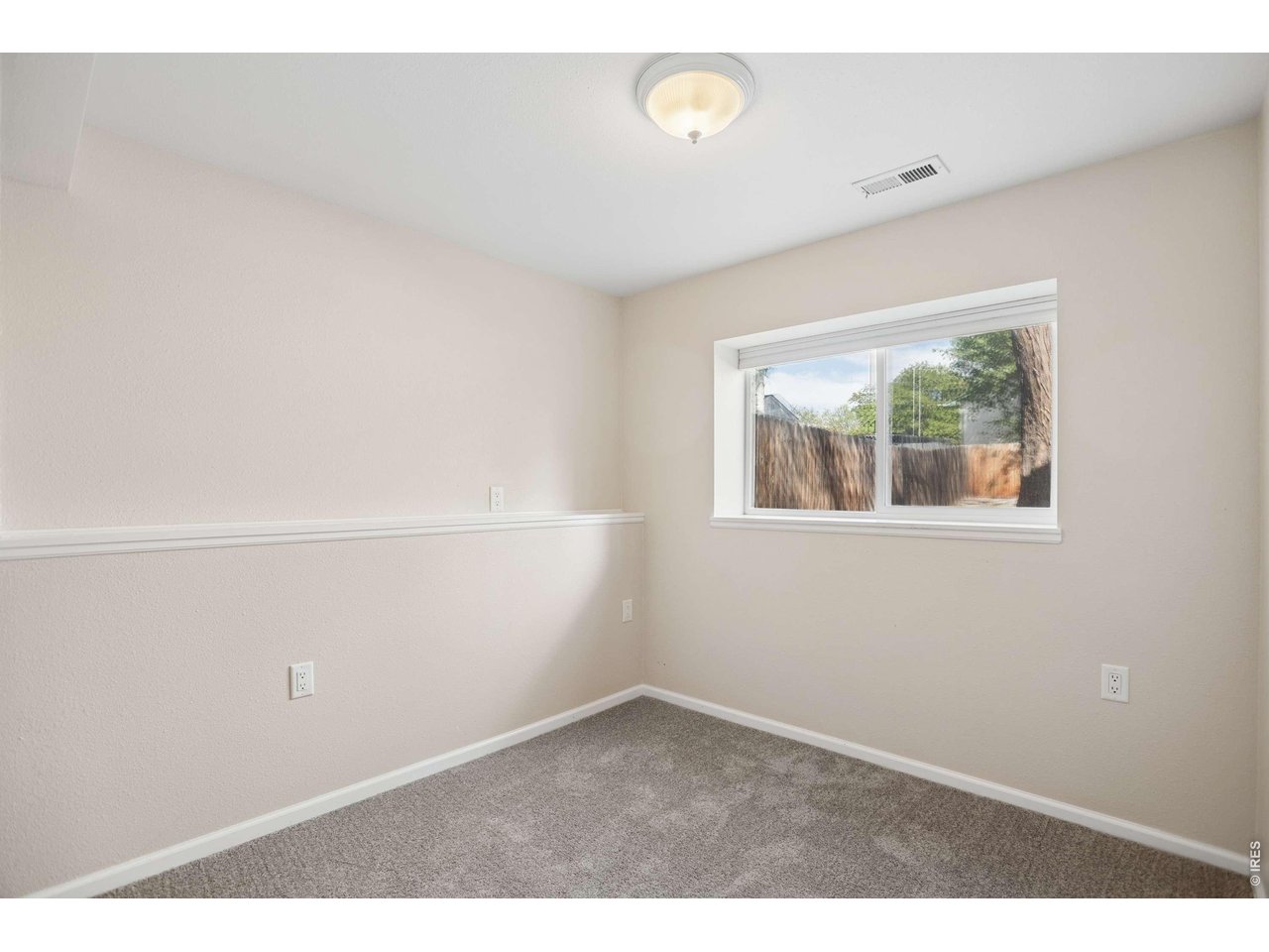 158 4th Street Firestone, CO 80520 - Photo 17 of 32 an empty room with a window