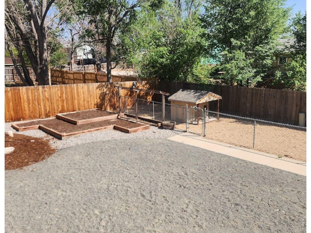 158 4th Street Firestone, CO 80520 - Photo 22 of 32 a backyard of a house with table and chairs