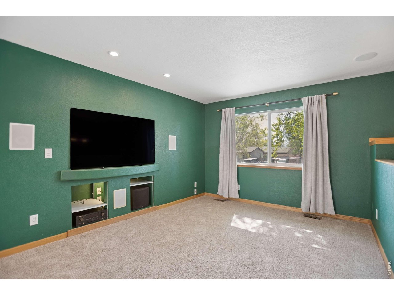 158 4th Street Firestone, CO 80520 - Photo 3 of 32 a living room with window and a flat screen tv