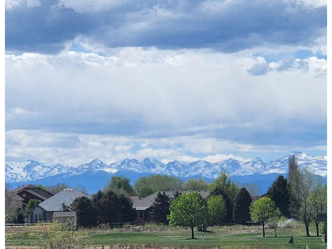 158 4th Street Firestone, CO 80520 - Photo 32 of 32 an aerial view of a house with a yard and mountain view in back