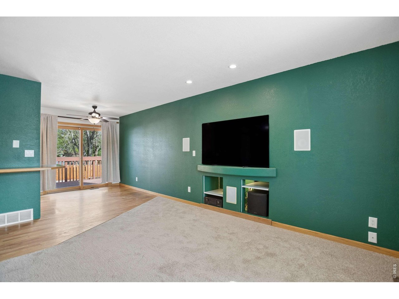 158 4th Street Firestone, CO 80520 - Photo 4 of 32 a living room with a flat screen tv and a projector