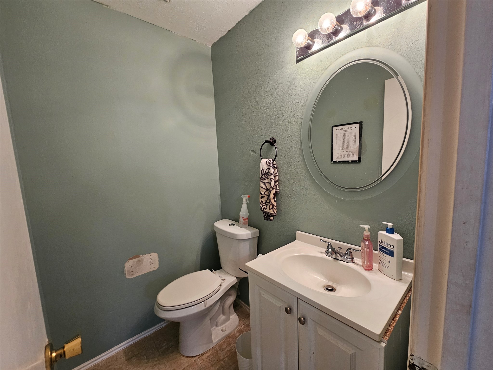 13615 Repa Lane Houston, TX 77014 - Photo 14 of 30 a bathroom with a sink mirror and toilet