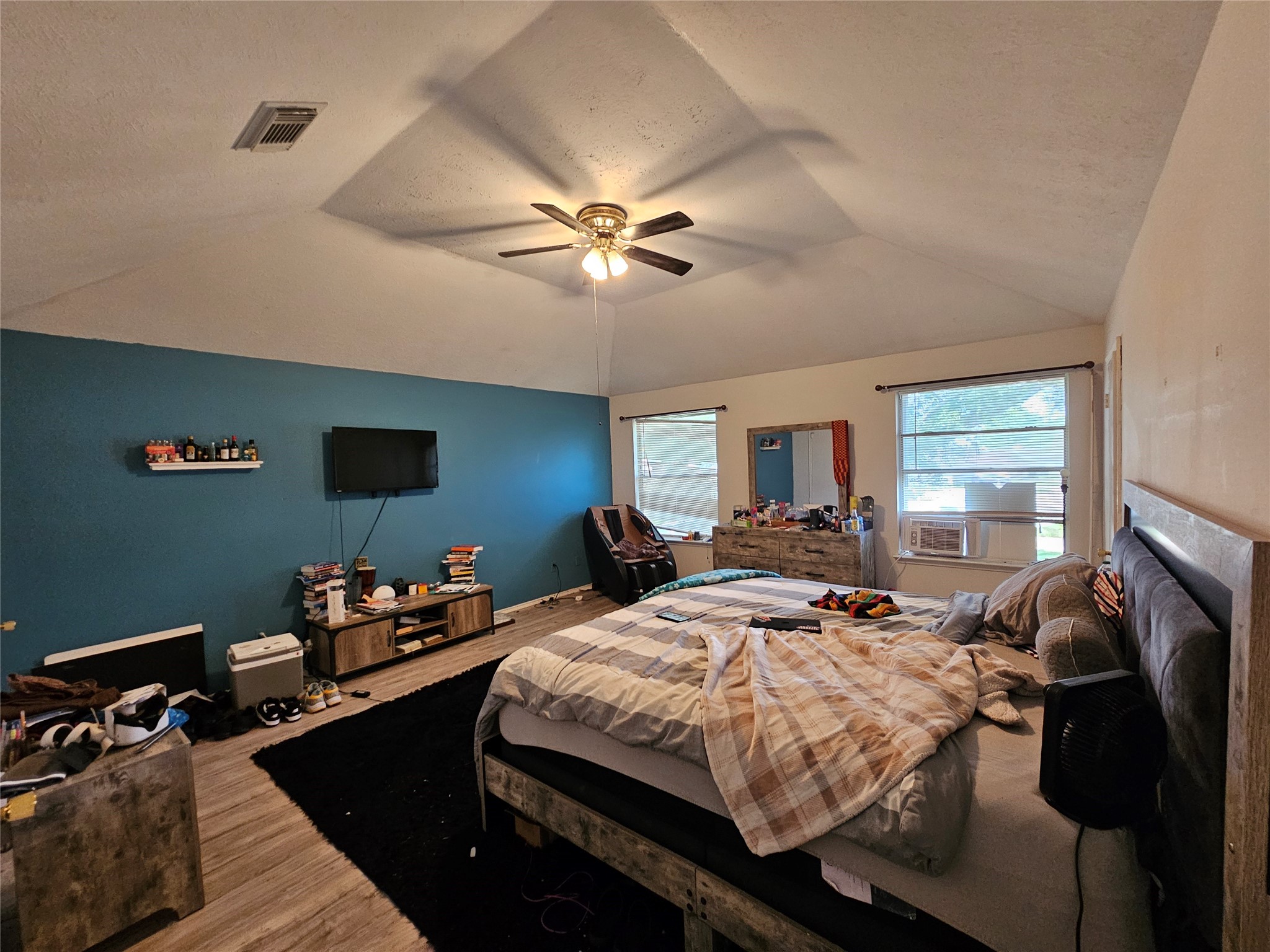 13615 Repa Lane Houston, TX 77014 - Photo 15 of 30 a bedroom with a bed and a chandelier