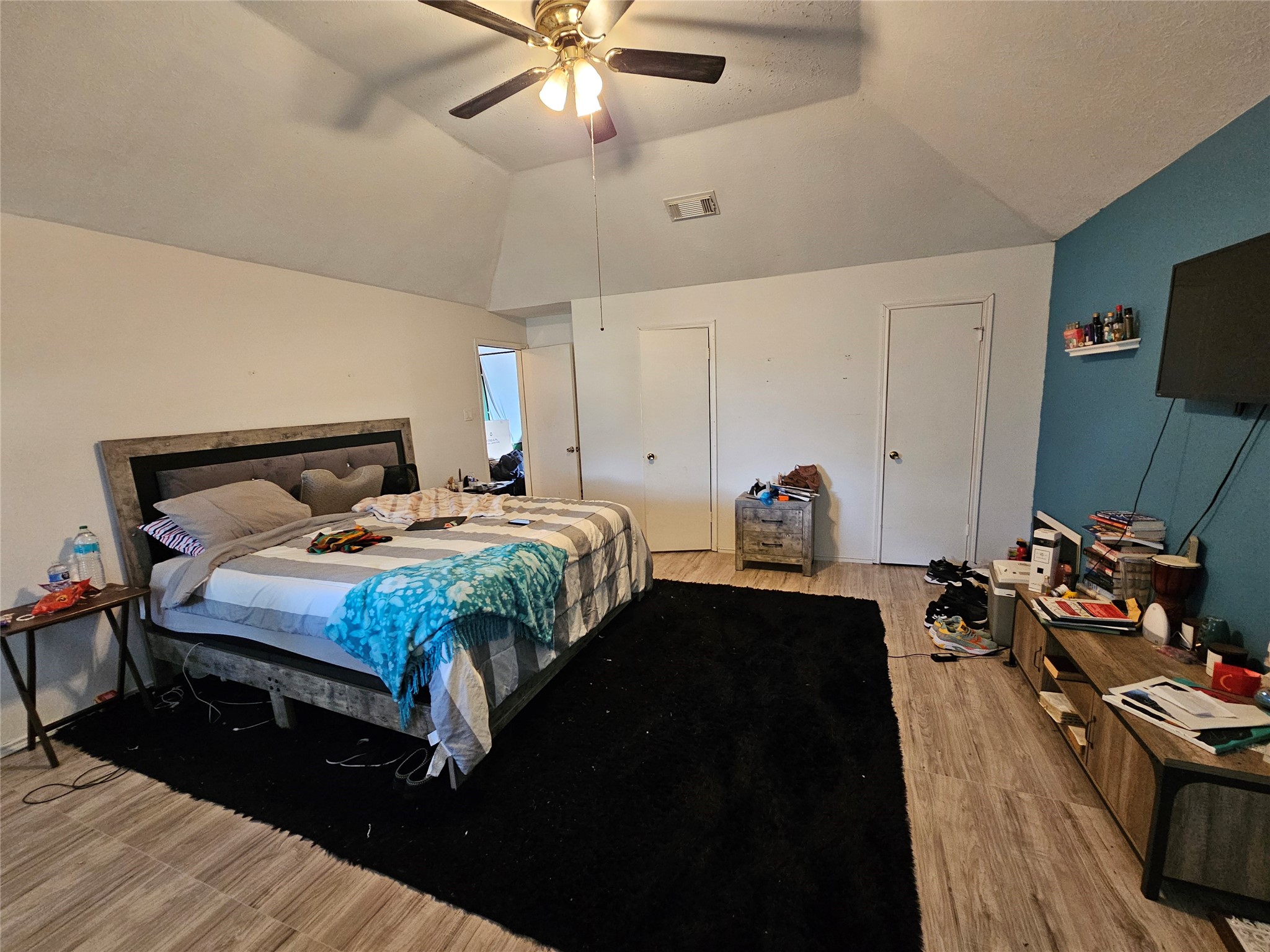 13615 Repa Lane Houston, TX 77014 - Photo 16 of 30 a bedroom with bed and a chandelier