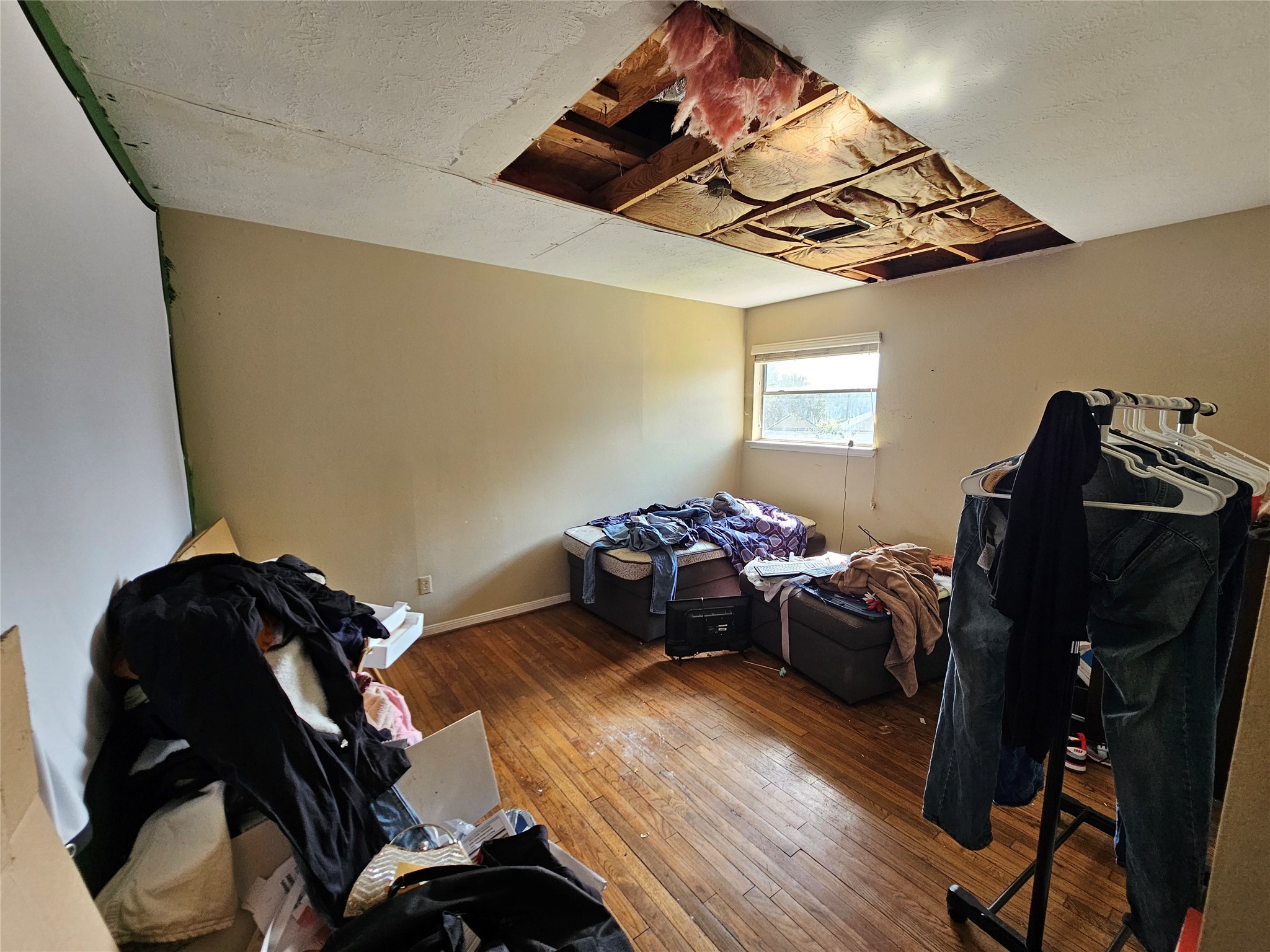 13615 Repa Lane Houston, TX 77014 - Photo 21 of 30 a bedroom with furniture and wooden floor