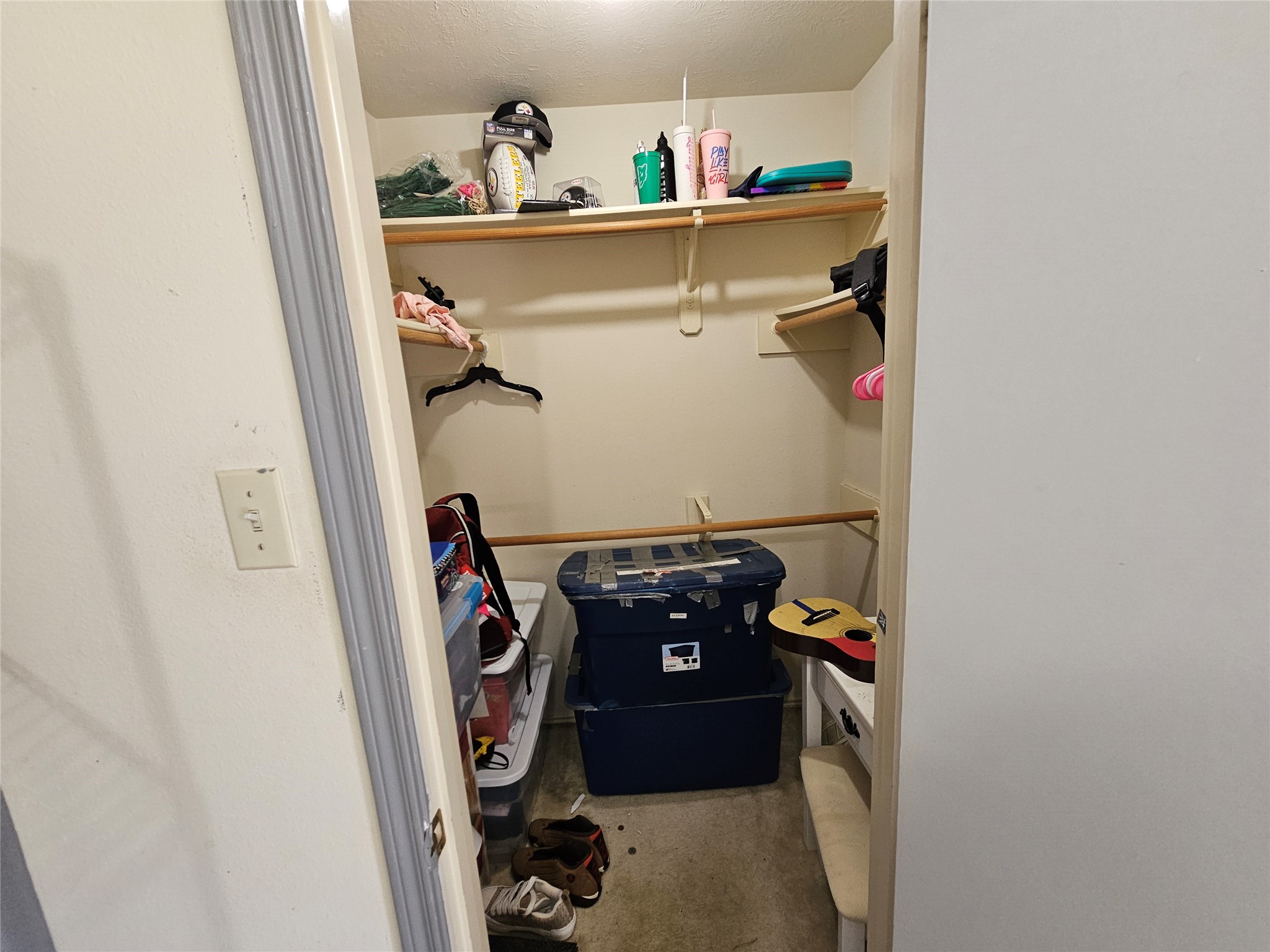 13615 Repa Lane Houston, TX 77014 - Photo 24 of 30 a view of walk in closet with clothes and shoes